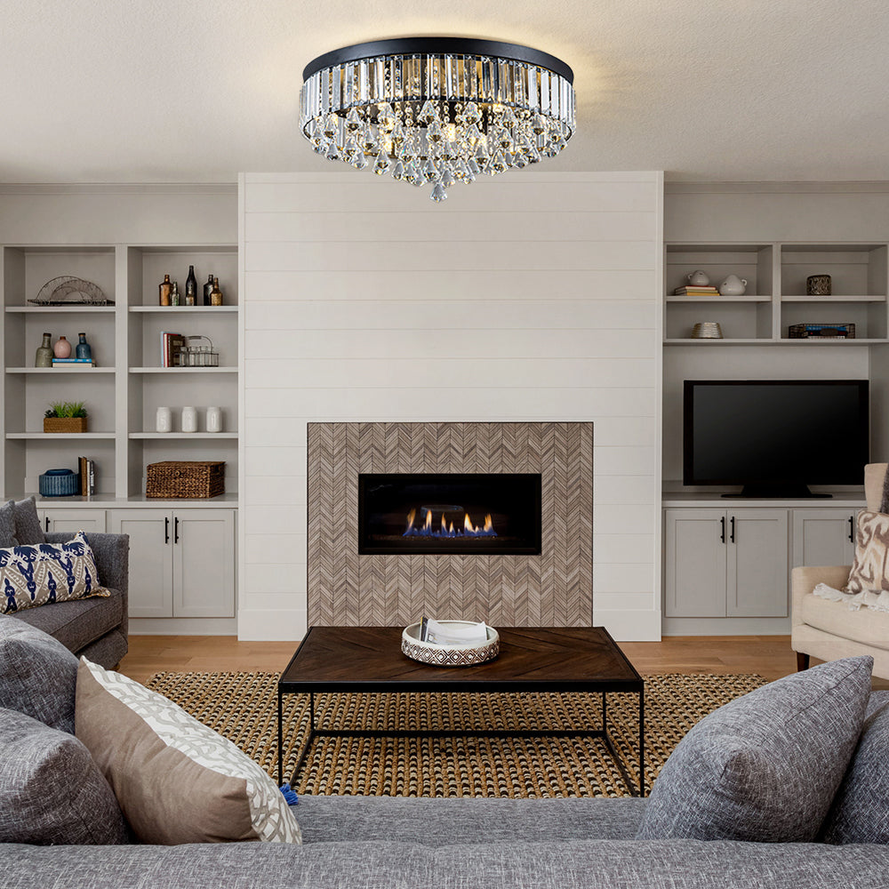 Modern living room with a fireplace, chandelier, and furniture.