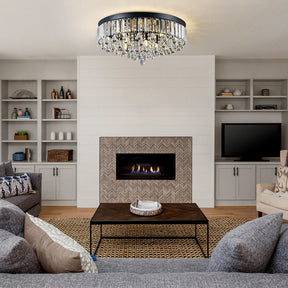 Modern living room with a fireplace, chandelier, and furniture.